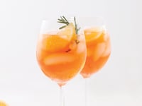 Photo de la Recette: Spritz à L’orange, Citron et Romarin